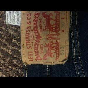Levis jeans - worn in knee, one has hole